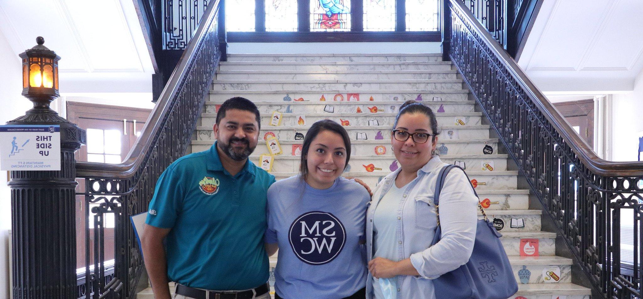 Family stands a student at move-in day